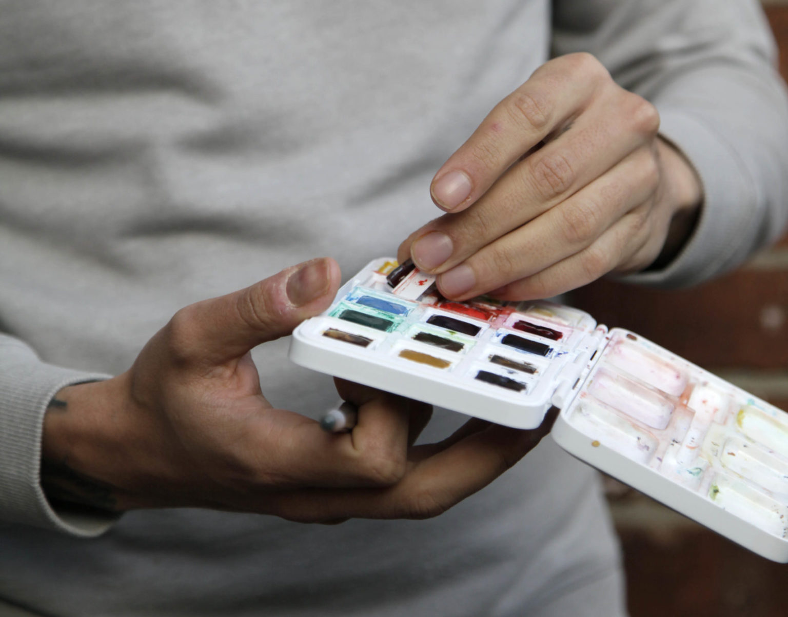 Holding my watercolour box, my most precious materials